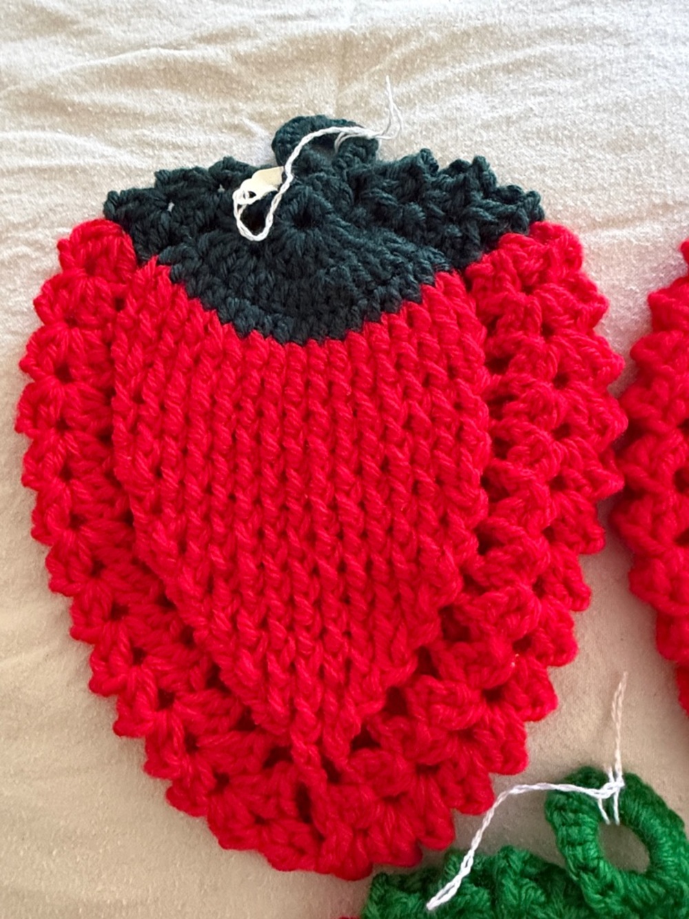 Three Handmade Red Crochet Strawberry Pot Holders with Green Tops - Picture 3 of 5